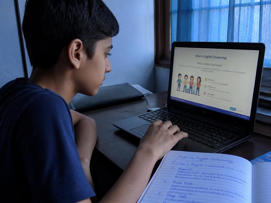 Younger Gen Z student completing an online digital literacy module on a laptop